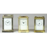 Three carriage clocks, to include a Churchill, with four bevelled glass sides, balance wheel window,