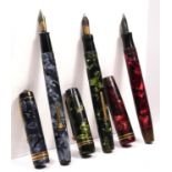 A Parker Duofold red marbled fountain pen with 14K gold nib, a Conway Stewart 388 blue mottled