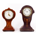 An Edwardian inlaid balloon shaped mantel clock, having butterfly marquetry decoration, with