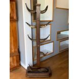 A Victorian oak hall stand, with ten cow horn branches, terminating in a plated ball finial, with