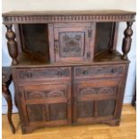 A late 19th early 20th century buffet serving cabinet, having central cupboard to the top, two