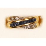 A 9ct gold sapphire and diamond crossover ring, J, 1.9gm
