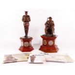 A pair of Danbury Mint bronzed sculptures of WW1 soldiers, on wooden plinths with sets of silver