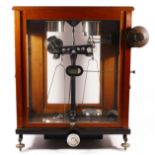 A mid 20th century cased set of scientific scales, analytical balance, circa 1960, mahogany with