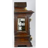 A late 19th early 20th Century German mahogany cased bracket clock, the break-arched dial with