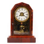 An early 20th century New Haven Clock Co mantel clock, the hexagonal shaped mahogany case opening to
