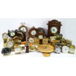 A collection of early 20th century and later mantel clocks, to include 8 day examples and Smiths