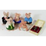 A set of five NatWest ceramic 'Piggy Banks' together with a silver plated egg cup & spoon in