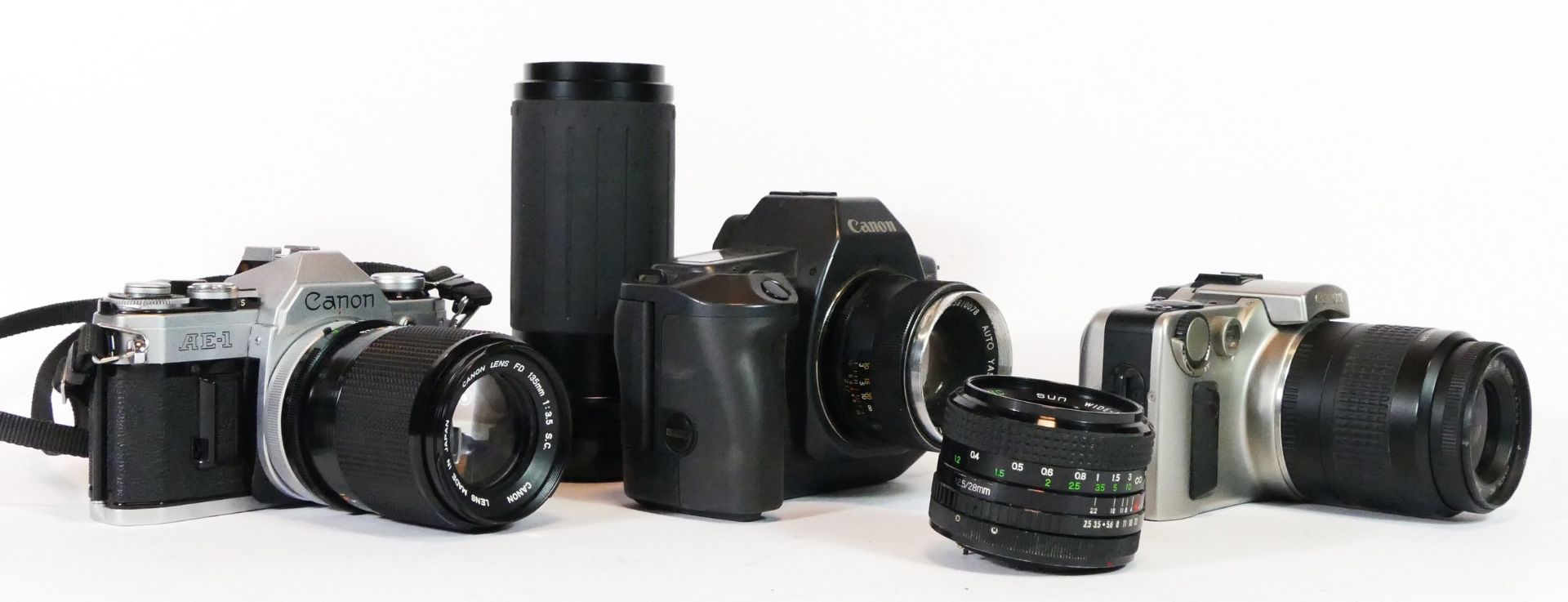 Three Canon cameras, to include a AE-1, a EOS600 and a EOs IX, with lens, together with two - Image 2 of 2