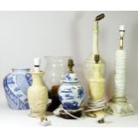 A collection of table lamps, to include marble and stone examples, together with a blue & white