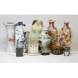 A German made vase, with pinched opening, together with a pair of baluster vases, decorated with