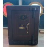 A Samuel Withers & Co of West Bromwich cast iron safe, the hinged door, opening to reveal a internal