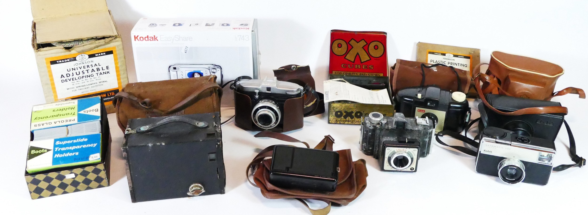 A collection of vintage cameras and equipment, to include a Kodak box Brownie, a Victor Coronet, a