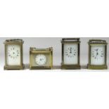 A rectangular carriage clock, painted enamel dial with Arabic numbers, gilt surround, balance