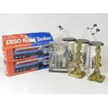 A pair of brass candlestick holders, a silk tie and cufflink set, boxed, Esso themed plastic drink