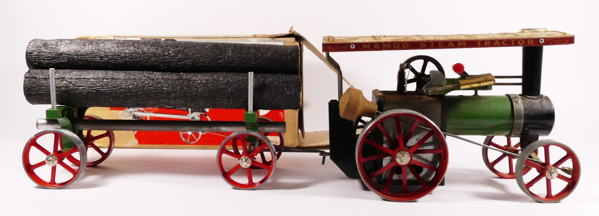 A Mamod live steam tractor, together with a Mamod lumber wagon (boxed) (2)