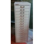 A set of free standing metal document drawers, made by Bisley, consists of 15 drawers with metal
