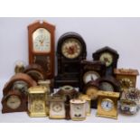 A collection of mechanical and quartz clocks, to include a Garrard carriage clock, boxed, mantle