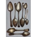 A George III silver pair of table spoons, London 1809, another London 1807, three other silver