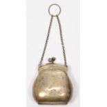 A silver purse, Birmingham 1918, with engraved decoration and lacking the interior, 6.5cm, 43gm