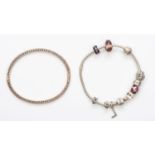 Pandora, a silver charm bracelet, and a Pandora and white stone hinged bangle, 55gm