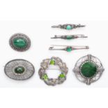 Seven various silver and green stone brooches, 58gm
