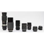 Seven manual focus camera lens, to include a Miranda 28mm f2.8 prime lens, a Vivitar 70mm-210mm f3.5