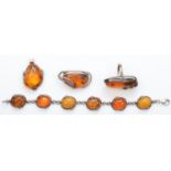 A collection of silver set amber jewellery, bracelet, ring, brooch and pendant, 57gm