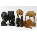 A collection of hand carved figures and animal models, to include African ebony busts of male and
