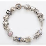 Pandora, a silver charm bracelet, box, 55gm
