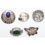 Five silver and gemset brooches, 30gm