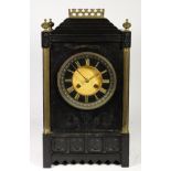 A Victorian Aesthetic period polished slate mantel clock, circa 1875-85, the black porcelain dial