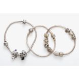 Pandora, three silver charm bracelets, 82gm
