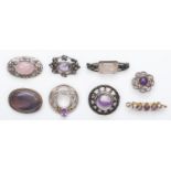 A Scottish silver and amethyst quartz target brooch and seven other silver and gemstone set