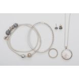Pandora, a silver charm necklace,a hinged bangle, a ring and a pair of era studs, box, 87gm