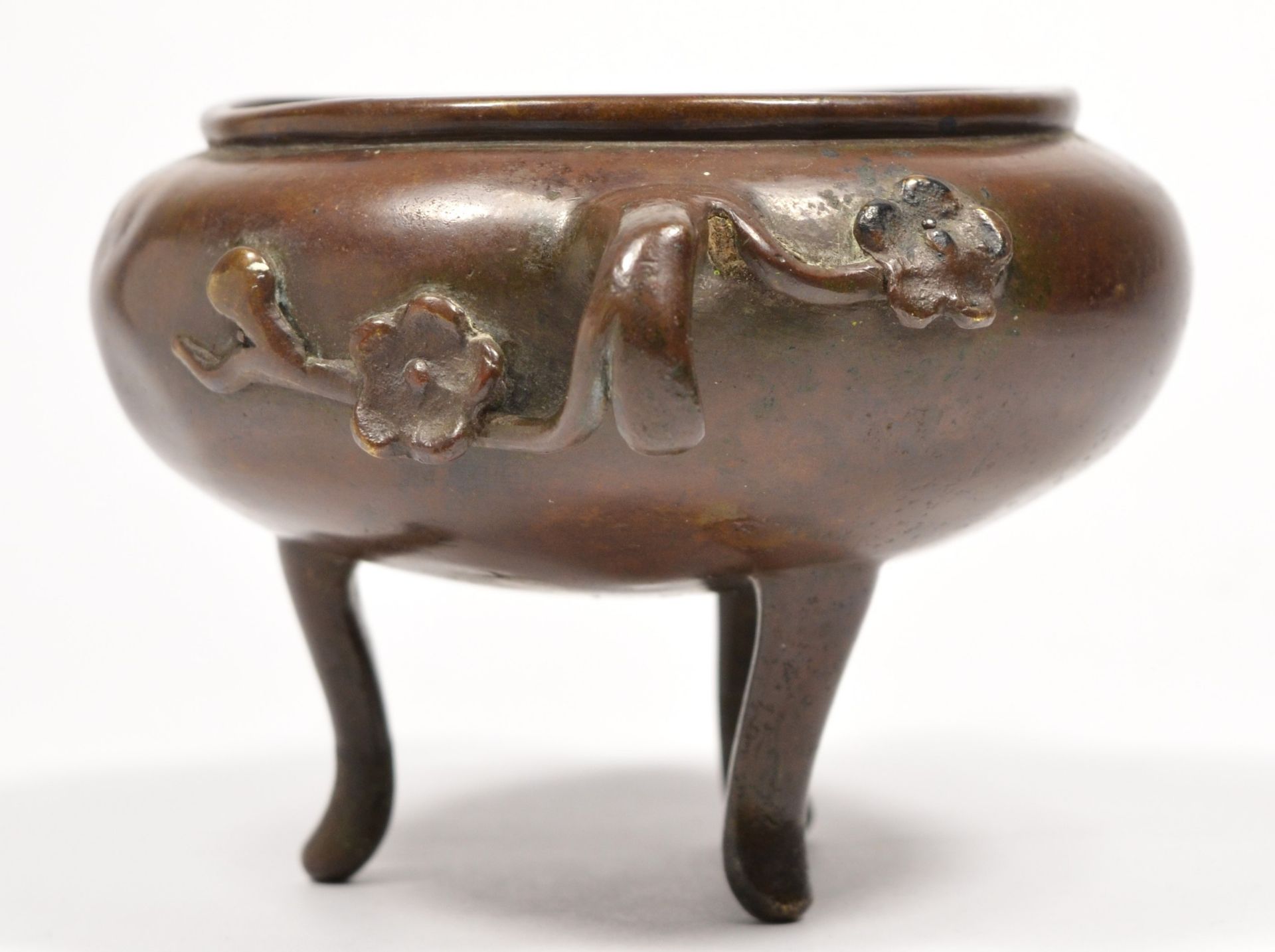 A Chinese bronze censor bowl, with peonie branch handles, raised on three legs, 15cm across handles. - Image 2 of 4