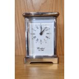 A Woodford chrome plated 8 day carriage clock, having white enamelled dial with Roman and Arabic