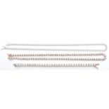 A silver and white stone claw set necklace, 46cm, a collet set example, 44cm and a line bracelet,