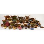 A collection of early 20th century copper lustre ware, to include various sized jugs, bowls, goblets