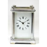 A French 8 day carriage clock, chrome plated case with enamelled dial and Roman numerals, movement