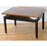 Ernst Gomme for G Plan - A 1950s Tola range teak Librenza pattern coffee table having a suspension