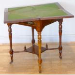 A 19th century mahogany and marquetry envelope games table, the envelope top inlaid with foliage,