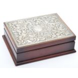 A silver mounted jewellery box, Sheffield 1992, with embossed floral and scroll decoration,