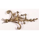 A Victorian 9ct and half pearl floral spray brooch, stamped 9ct, set with half pearls, 68 x 38mm,