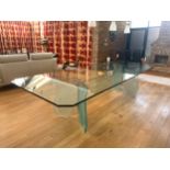 A stylish contemporary Italian designed dining table, comprising edged rectangular plate glass top