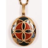 A Victorian Scottish gold and pebble oval locket, the double sided geometric design set with various