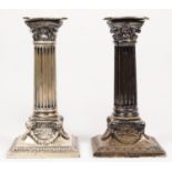 A Victorian silver pair of corinthian column candlesticks, by Martin & Hall, London 1891, with