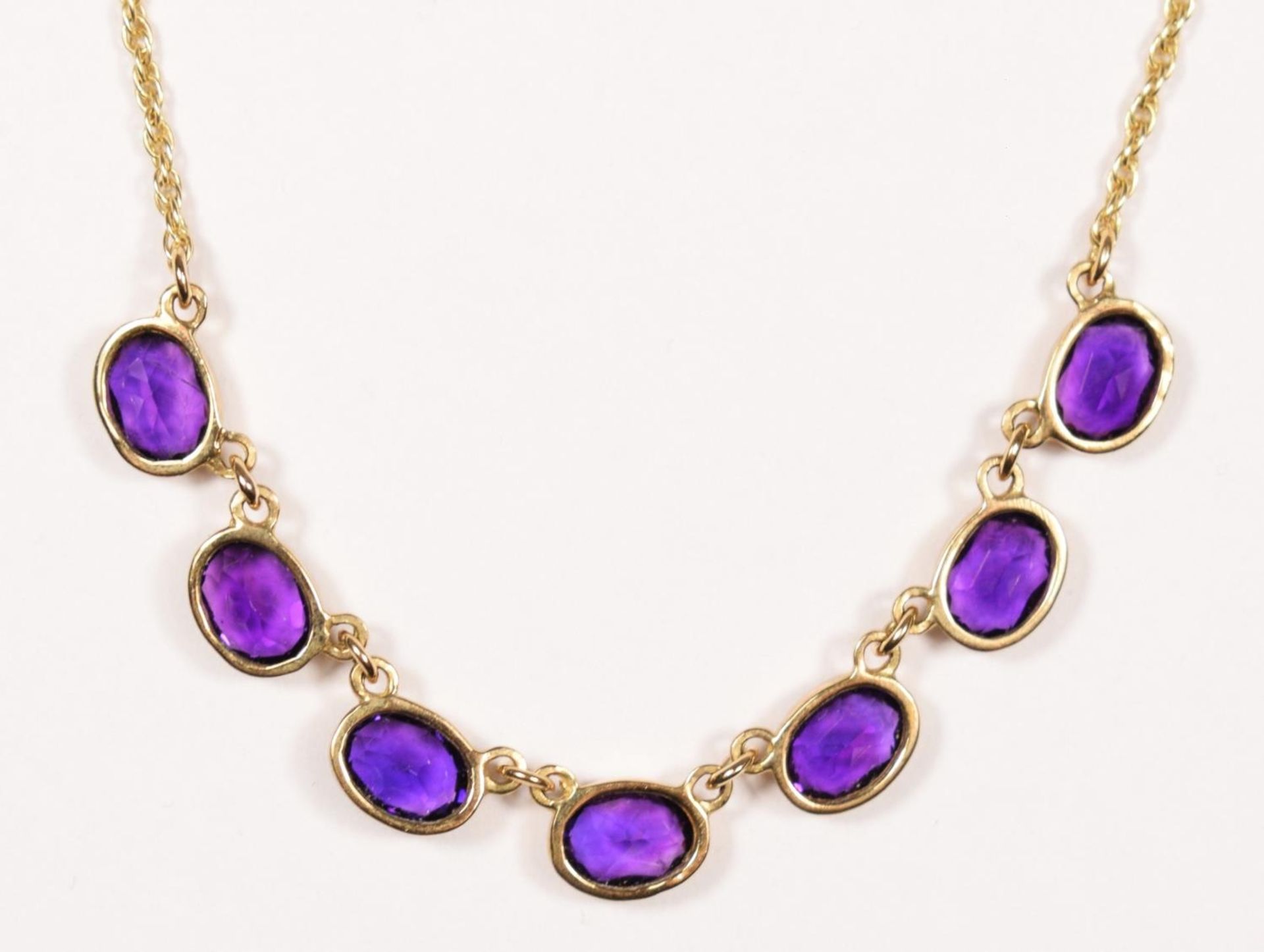 A Victorian style 9ct gold and amethyst necklace, Birmingham 1967, collet set with seven mixed cut - Image 3 of 3