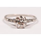 An Edwardian platinum and diamond single stone ring claw set with an old brilliant cut stone,