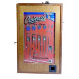 A Cascade De Luxe by Bell Fruit Manufacturing penny drop case slot machine, mahogany cabinet, serial